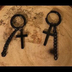 Cross and bone earrings.